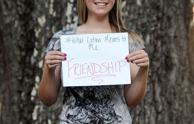 The Hispanic Student Cultural Society make signs about what being Latino means to them.