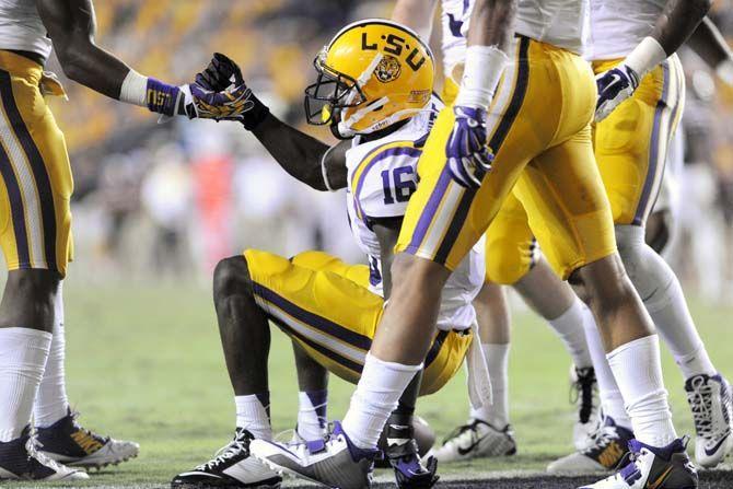 LSU sophomore defensive back Tre'Davious White (16) is helped up by a teammate in Tiger Stadium Saturday, September 20, 2014 in Tigers' defeat 34-29 against Mississippi State University.