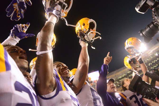 LSU football head coach Les Miles and members of the team celebrate Saturday, September 6, 2014 after the Tigers' 56-0 win against Sam Houston State in Tiger Stadium.