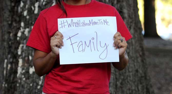 The Hispanic Student Cultural Society make signs about what being Latino means to them.