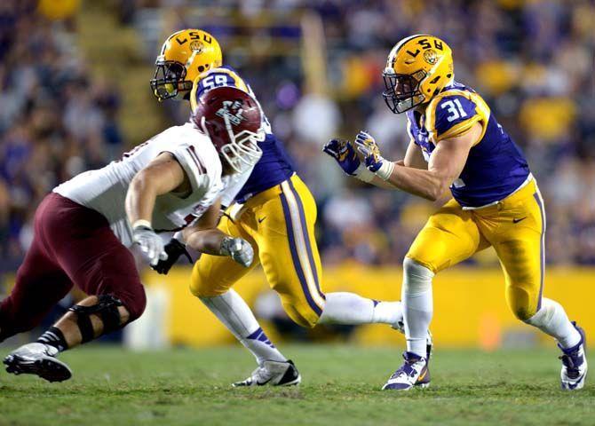 LSU senior linebacker DJ. Welter prepares to tackle NMSU player Saturday, September 27, 2014 during the Tigers' 63-7 victory against the Aggies in Tiger Stadium.