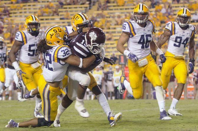 LSU junior cornerback Jalen Collins (32) takles a Mississippi State player during the game Saturday September 20, 2014 where LSU lost 34-28 in Tiger Stadium.