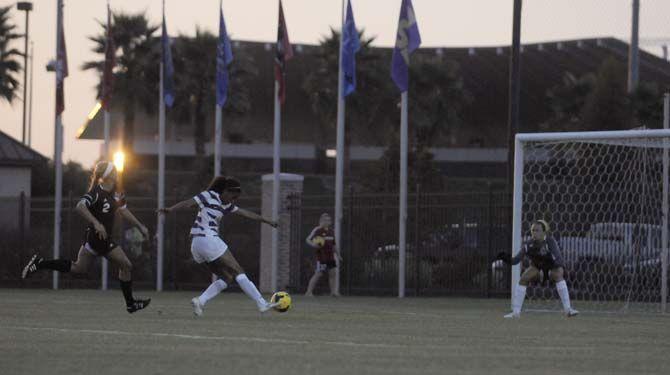 LSU sophomore forward Summer Clarke (4) shoots on target Friday, August 22, 2014 during the Tigers' 2-0 victory against Troy in LSU Soccer Stadium.