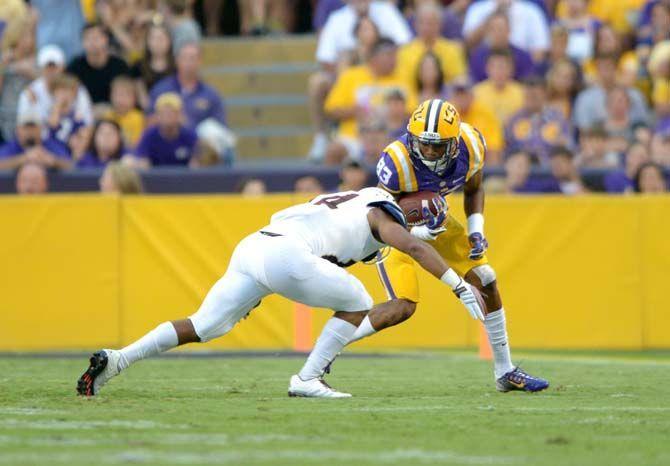 LSU sophomore wide receiver Travin Dural (83) goes up against a ULM defender Saturday, Sep. 13, 2014 during the Tigers' 31-0 victory against the Warhawks in Tiger Stadium.