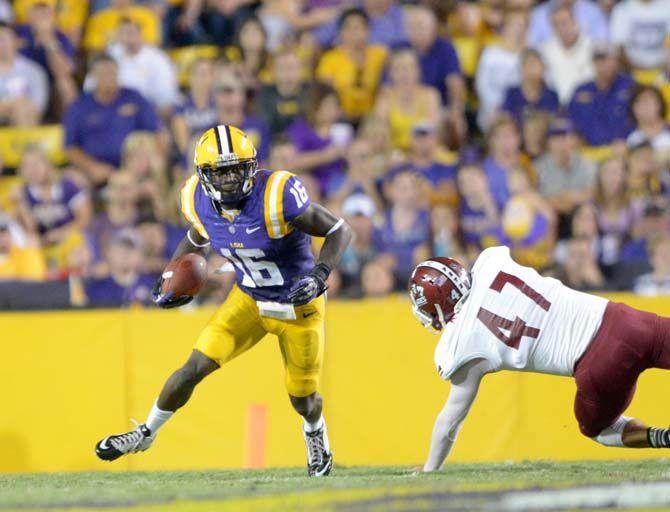 LSU sophomore defensive back Tre'Davious White (16) dodges a tackle in game against NMSU Saturday, September 27, 2014.