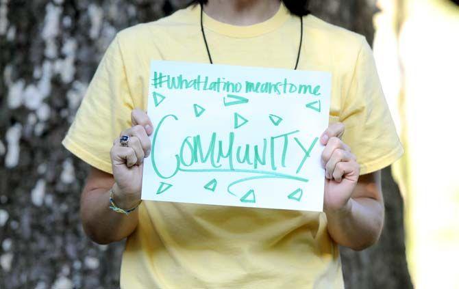 The Hispanic Student Cultural Society make signs about what being Latino means to them.