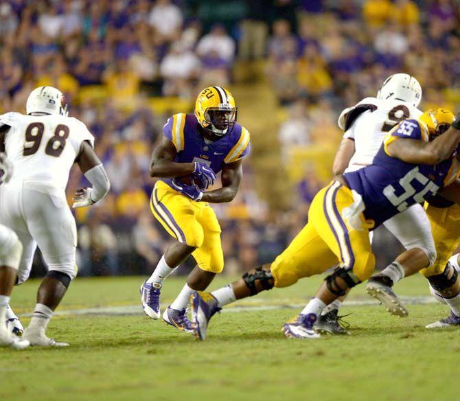 Freshman running back Leonard Fournette (7) finds a hole during the Tigers' 31-0 victory against ULM on Saturday, September 13th, 2014.