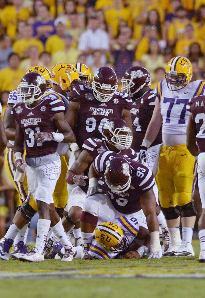 LSU sophmore quarterback Anthony Jennings (10) gets tackled by Mississippi State senior defensive tackle P.J. Jones during the game Saturday September 20, 2014 where LSU lost 34-29 in Tiger Stadium.