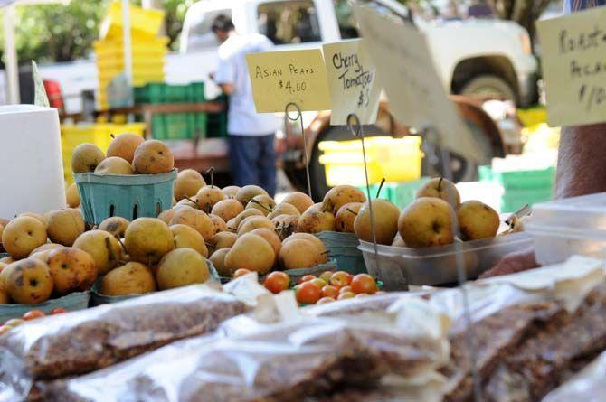 Asian pears and an assortment of other fruits sit displayed at Buddy Miller's stand at the Red Stick Farmer's Market Saturday, September 20, 2014.