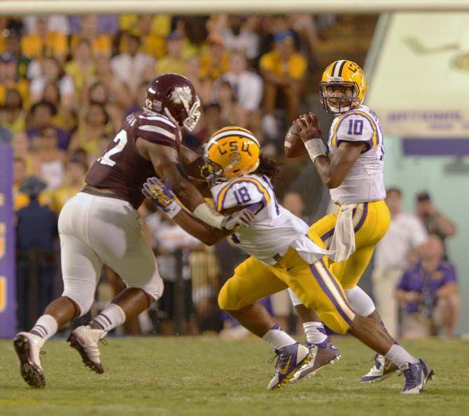 LSU sophomore quarterback Anthony Jennings (10) passes the ball as senior running back Terrence Magee (18) blocks opponent in Tiger Stadium Saturday, September 20, 2014 in Tigers' defeat 34-29 against Mississippi State University.