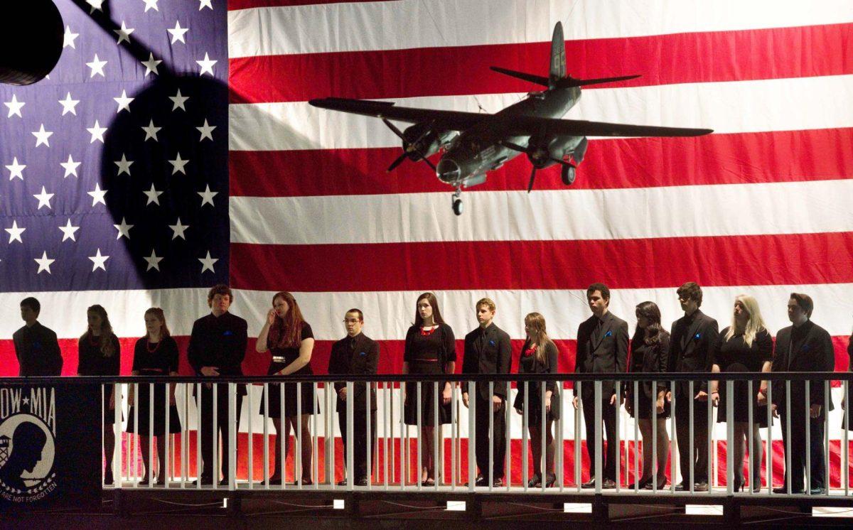 Chorus students from Niceville High School, Fla., wait to sing the National Anthem Friday during a POW MIA memorial ceremony held at the Air Force Armament Museum near Eglin Air Force Base in Fort Walton Beach, Fla. Sept. 19, 2014. (AP Photo/Northwest Florida Daily News, Devon Ravine)