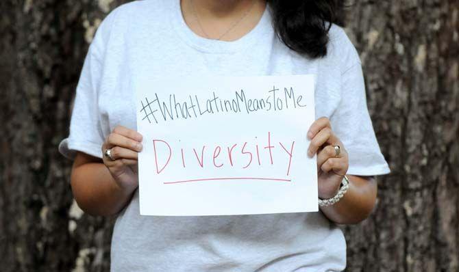 The Hispanic Student Cultural Society make signs about what being Latino means to them.