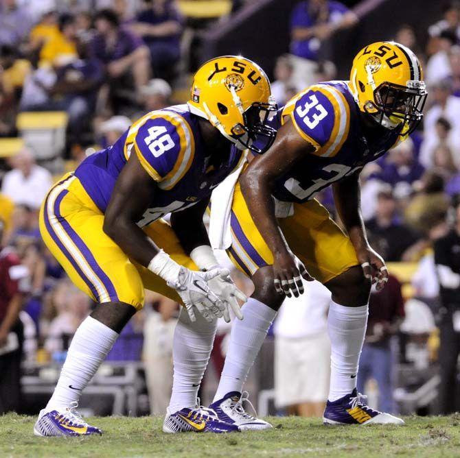 LSU freshman safety Jamal Adams and freshman line backer Donnie Alexander get into starting position Saturday, September 27, 2014 during the Tigers' 63-7 victory against the Aggies in Tiger Stadium.