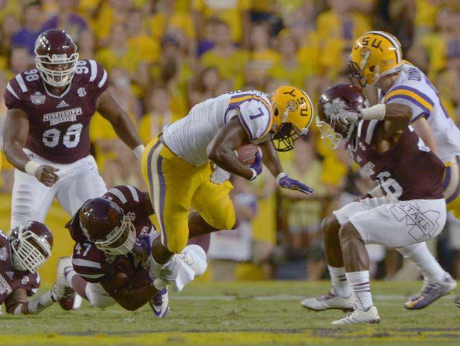 LSU freshman running back Leonard Fournette (7) gets tackled by Mississippi State sophmore defensive line A.J. Jefferson (47) in Tiger Stadium on Saturday September 20, 2014 where LSU lost 34-29.