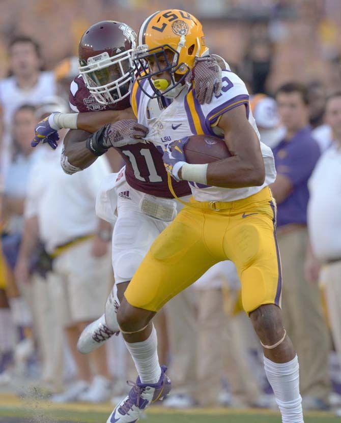 LSU freshman wide receiver Malachi Dupre (15) gets tackled by Mississippi St. defensive back Kivon Coman (11) Saturday September 20, 2014 where LSU lost 34-29 in Tiger Stadium.