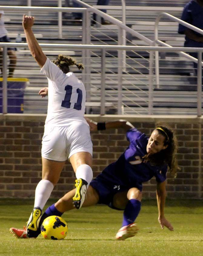 LSU midfielder Fernanda Pi&#241;a slides for the ball in game agains Stephen F. Austin Monday, September 8, 2014.