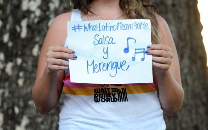 The Hispanic Student Cultural Society make signs about what being Latino means to them.