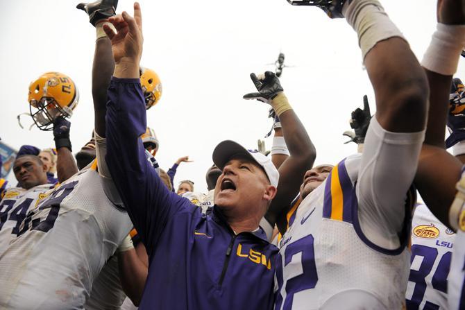 LSU head football coach Les Miles sings the alma mater Wednesday, Jan. 1, 2014 after the Tigers' 21-14 victory against the Iowa Hawkeyes in the Outback Bowl at Raymond James Stadium in Tampa, Florida.