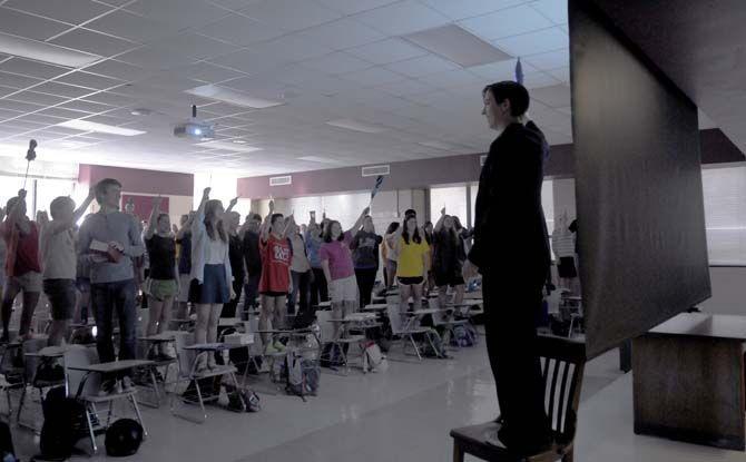 Dr. Barrett talks to the class about Henry the V. She had all the students stand up and participate in the reading on Wednesday, September 17, 2014