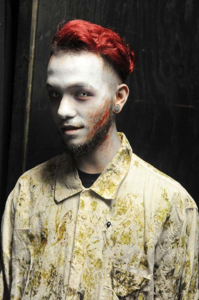 Actors sit backstage to get their makeup done for their role in the 13th Gate.