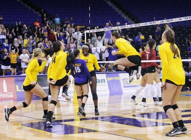 LSU volleyball team celebrates their first home vicotry Sunday, October 5,2014 against Arkansas in the PMAC.