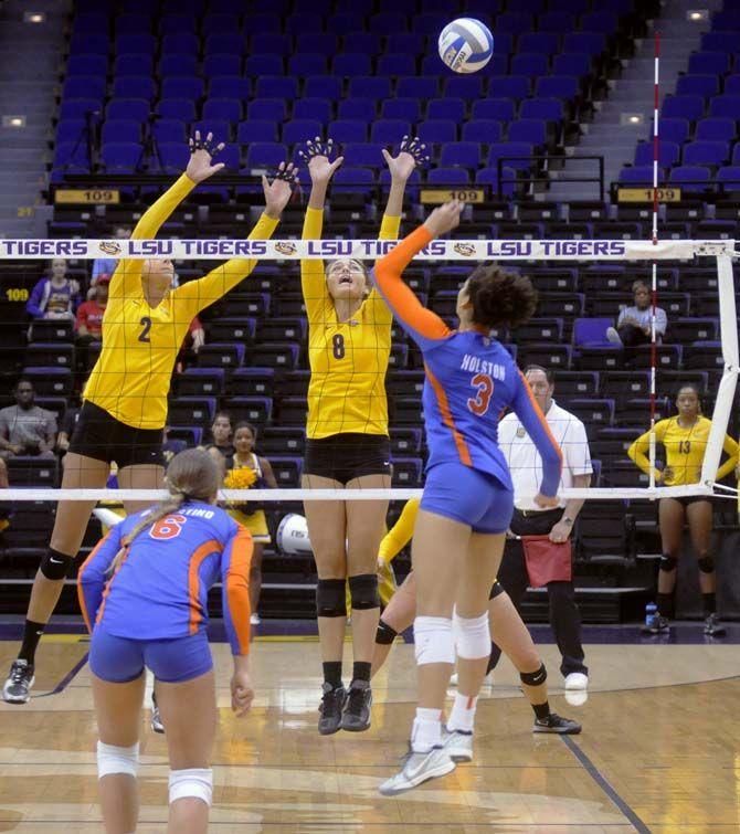 LSU senior outside hitter Helen Boyle and junior outside hitter Emily Ehrle (2) attempt to block the ball during the Tigers' 1-3 defeat against Florida Friday, October 3, 2013 in the PMAC