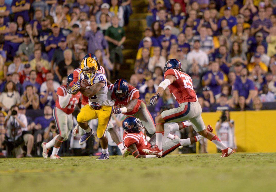 LSU senior runningback Terrance Magee (18) runs the ball In Tiger Stadium Saturday, October 25, 2014 where Tigers won 10-7 against Ole Miss.