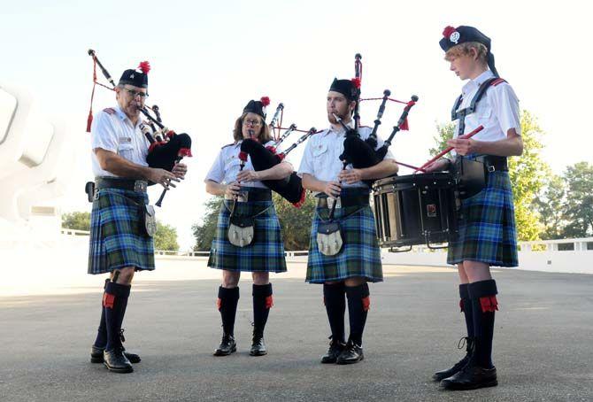 Members of the Baton Rouge Caledonian Pipes and Drums (left to right), Stan Masinter, Rosemary John, Thomas Martin and Ellis Jackson, perform Saturday, October 11 outside the PMAC.