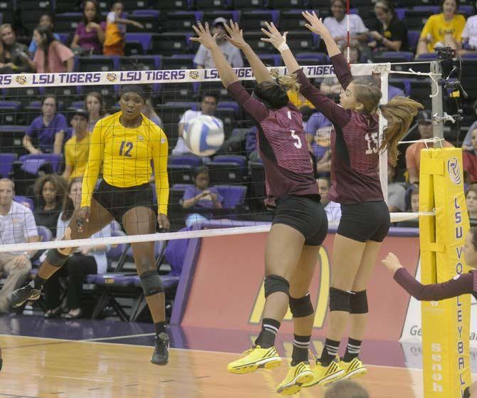 LSU freshman outside hitter Gina Tillis (12) scores a set poing during Tiger's victory 3-0 against Mississippi State Wednesday, October 8, 2014 in the PMAC.