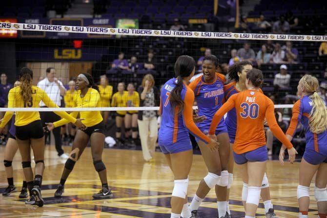 Florida Volleyball team celebrates their victory the during the Tigers' 1-3 defeat Friday, October 3, 2014 in the PMAC.