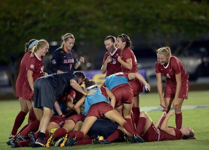 Alabama celebrates their vicroty in overtime during Tigers' 2-3 defeat Thursday, October 9, 2014 in the LSU Soccer Stadium.