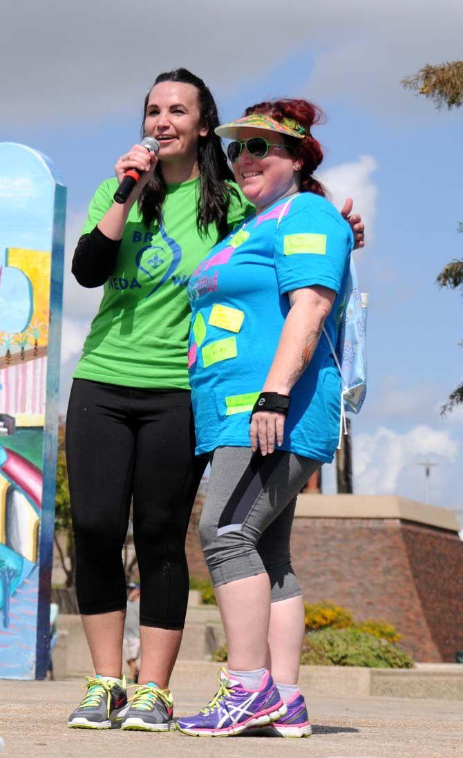 Event organizer, Dani Crockett, poses with "BeYOUtiful" team captain, Kelly Boffone, for her team raising the most money for the National Eating Disorder Association (NEDA) walk that occured at the Riverfront Plaza on October 11, 2014.