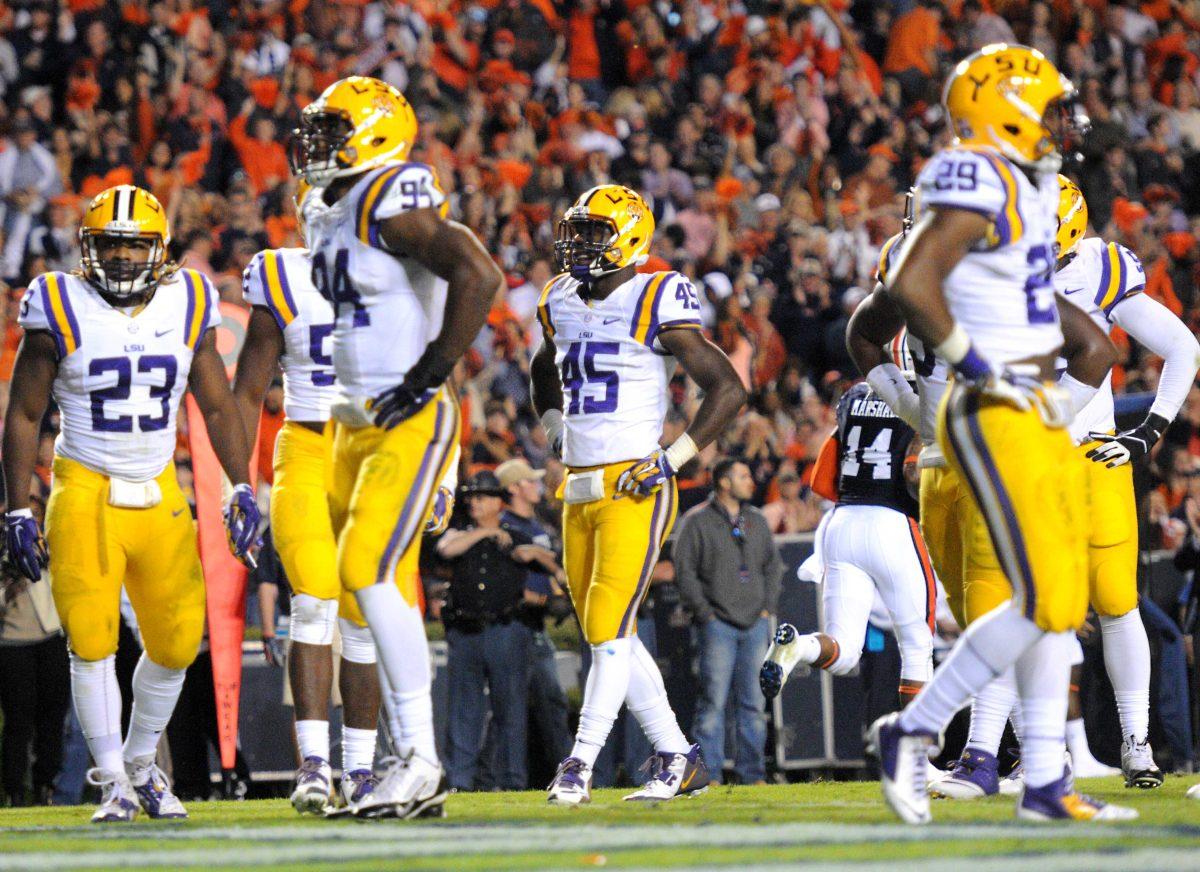 LSU junior linebacker Deion Jones (45) and his teammates react after a touchdown made by Auburn, October 4, 2014 in Jordan-Hare Stadium.