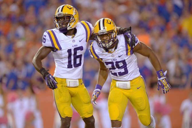 LSU sophomore defensive back Tre'Davious White (16) congratulates sophomore saftey Rickey Jefferson (29) for grabbing an interception late in the fourth quarter Saturday, October 11, 2014 during the Tigers' 30-27 victory in Ben Hill Griffin Stadium.