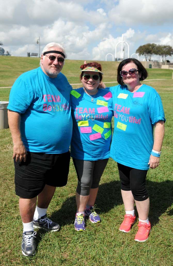 "BeYOUtiful" team captain, Kelly Boffone, poses with her parents at the National Eating Disorder Association (NEDA) walk at the Riverfront Plaza on October 11, 2014