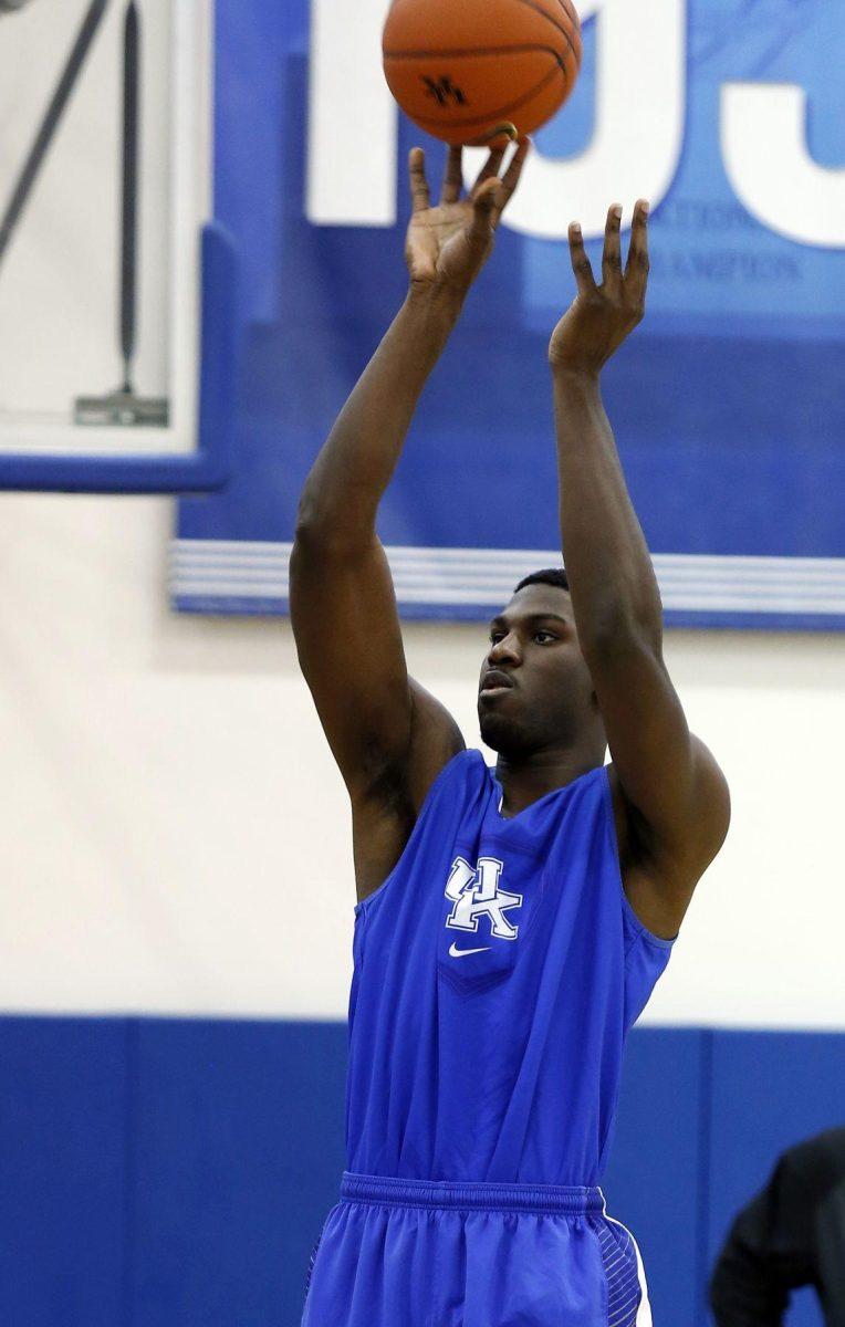 Kentucky's Alex Poythress shoots in practice during the team's NCAA college basketball media day, Thursday, Oct. 16, 2014, in Lexington, Ky. (AP Photo/James Crisp)