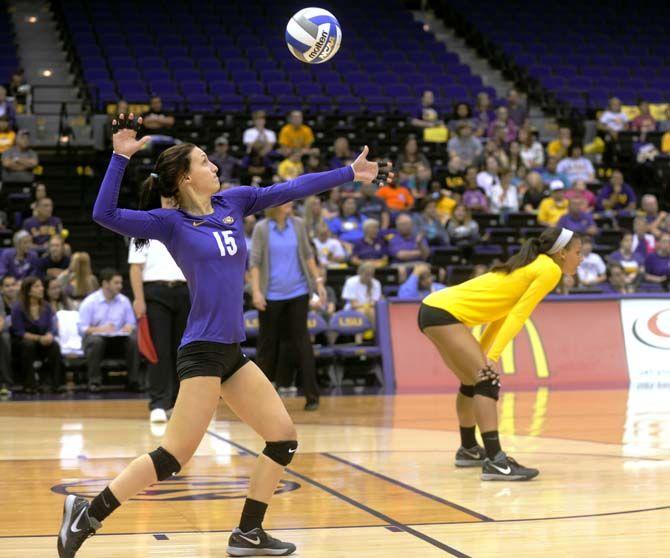 LSU junior defensive specialist Haley Smith (15) serves during Tiger's victory 3-2 against Arkansas Sunday, October 5, 2014 in the PMAC.