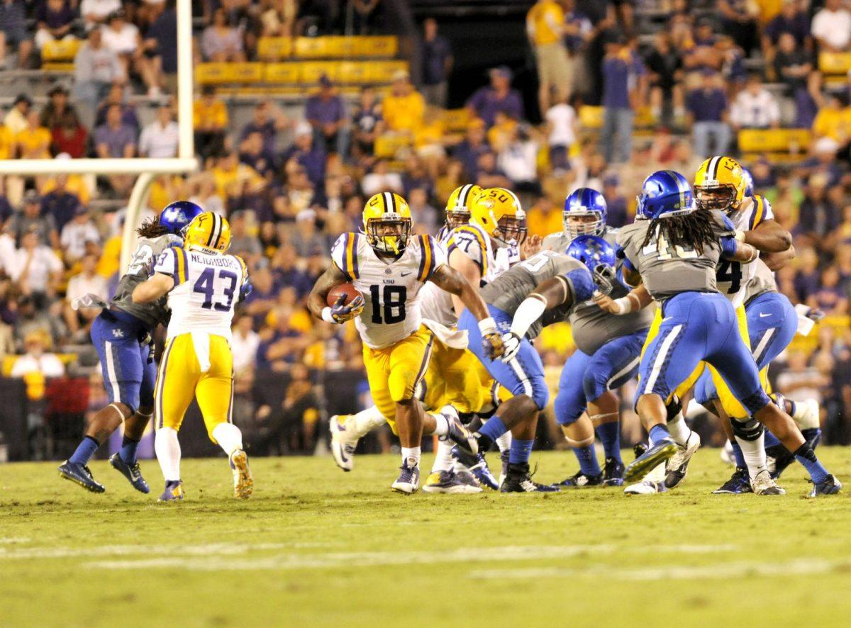 Senior running back Terrence Magee (18) runs for a gain during the Tigers' 42-3 win against Kentucky on Saturday, October 18th, 2014.