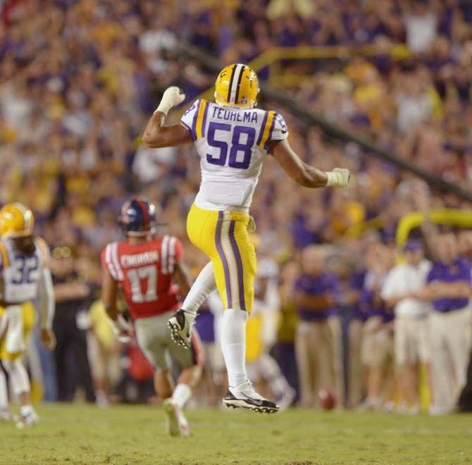 LSU freshman defensive end Sione Teuhema (58) celebrates a play during Tiger's 10-7 victory against Ole Miss Satruday, October 25, 2014 in Tiger Stadiumf