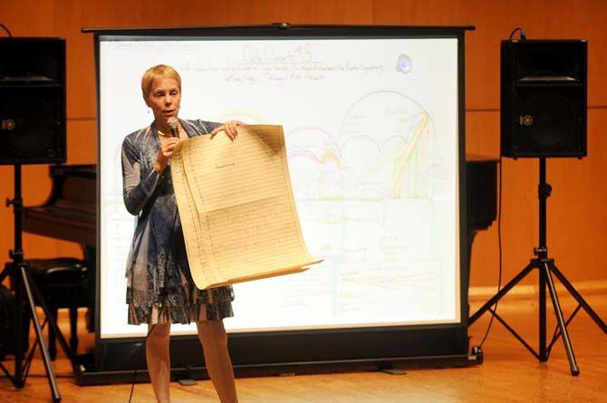 Composer Augusta Read Thomas shows off her handwritten sheet music in her lecture "The A.R.T. of Composing" on Tuesday, October 14, 2014.