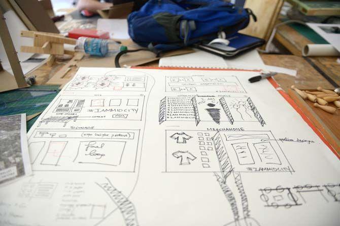 A sketch is drawn up for an exhibit curated by the Fall 2014 Mid City Studio class.