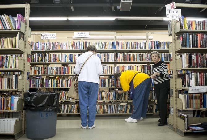 Shoppers browse the stacks at the LSU Libraries Friends of the Libraries Annual Book Bazaar on Thursday, March 20, 2014 in the 4-H mini barn.