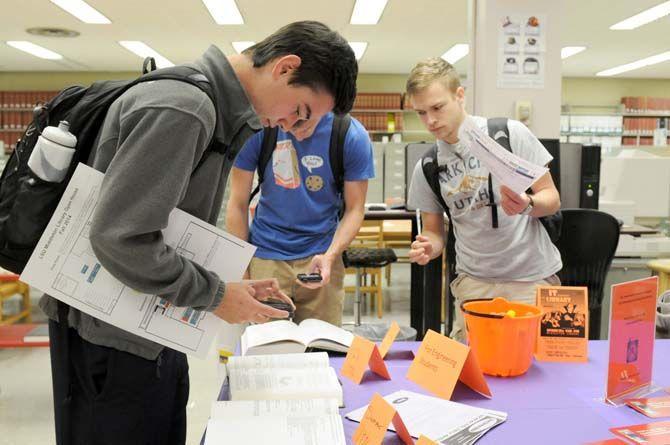 Engineering students participate in a game during the Halloween themed Library Open House in Middleton Wednesday, October 29, 2014.