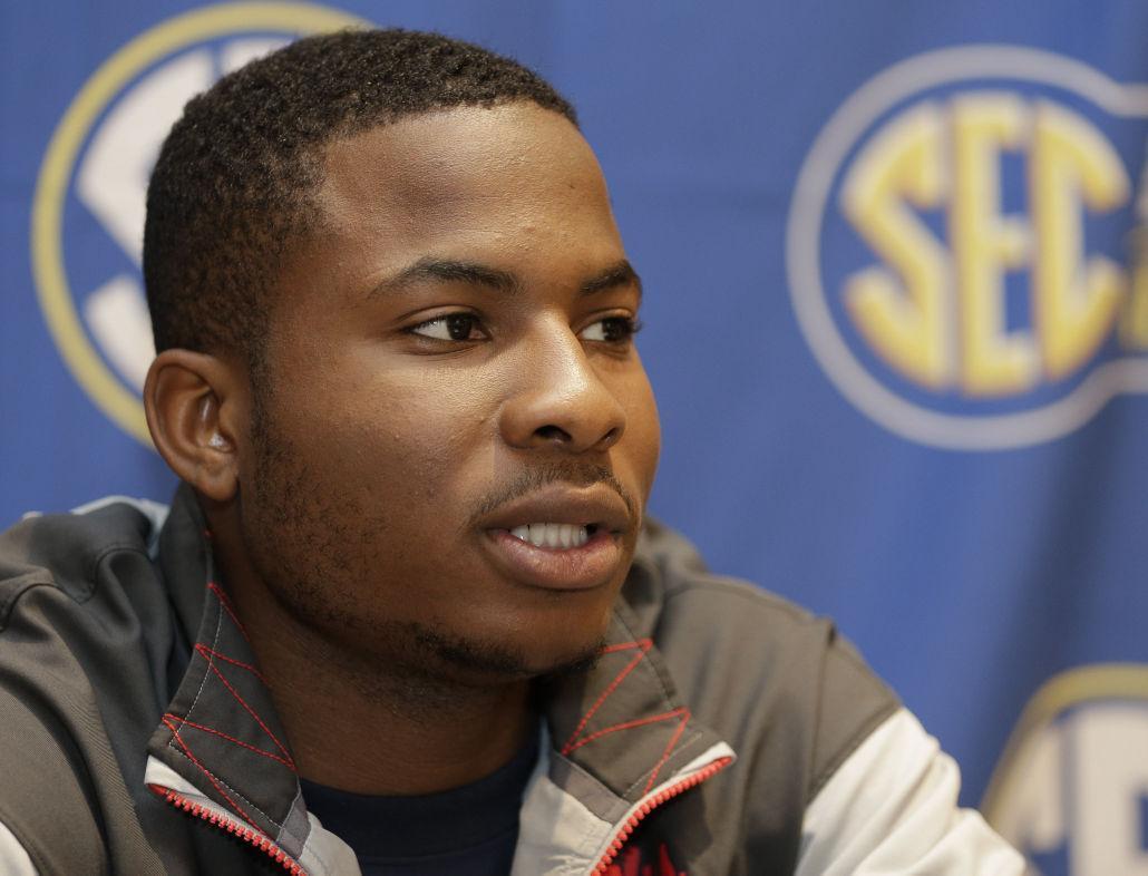 Mississippi's Jarvis Summers answers a question during a news conference at the Southeastern Conference NCAA men's college basketball media day in Charlotte, N.C., Wednesday, Oct. 22, 2014. (AP Photo/Chuck Burton)