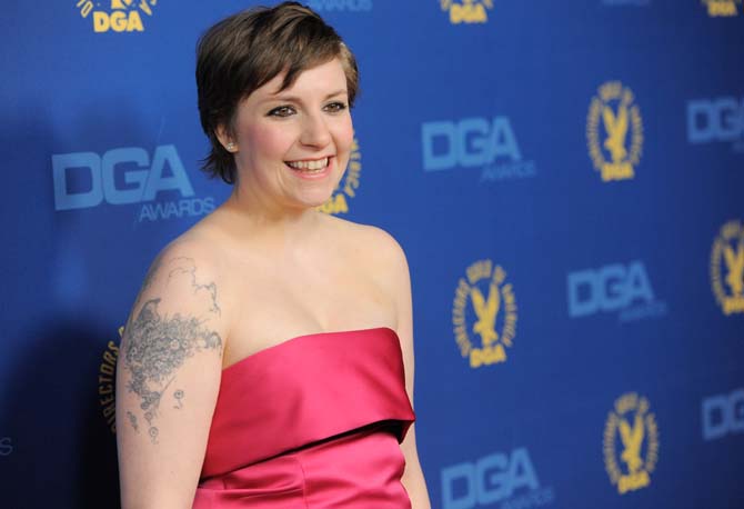 FILE - This Feb. 2, 2013 file photo shows Lena Dunham at the 65th Annual Directors Guild of America Awards at the Ray Dolby Ballroom in Los Angeles. Dunham is urging her fellow &#8220;Obies&#8221; to stick together as her alma mater in Ohio wrestles with reports of racism. The creator and star of HBO's &#8220;Girls&#8221; wrote on her Twitter account Monday, March 4, after learning about racist graffiti at famously liberal Oberlin College. (Photo by Chris Pizzello/Invision/AP, file)