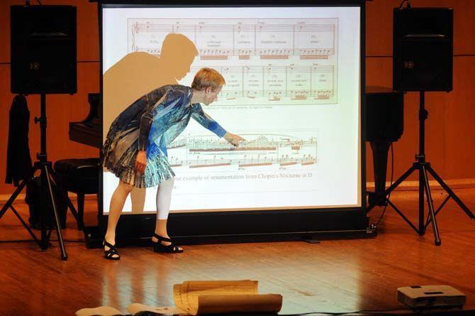 Composer Augusta Read Thomas points to Chopin sheet music in her lecture "The A.R.T. of Composing" on Tuesday, October 14, 2014.