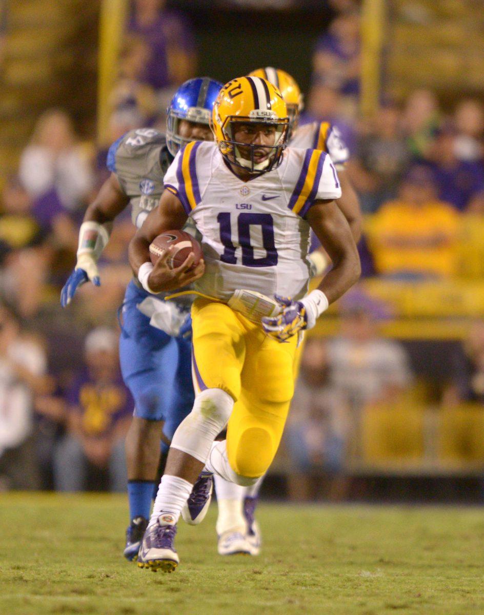 1 LSU's Anthony Jennings (10) runs the ball in LSU vs Kentucky (41 and 3) at Tiger Stadium October 18, 2014.