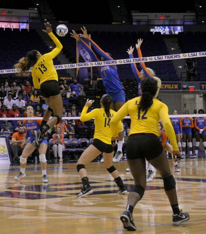 LSU sophomore middle blocker Briana Holman (13) spikes the ball during the Tigers' 1-3 defeat against Florida Friday, October 3, 2014 in the PMAC.