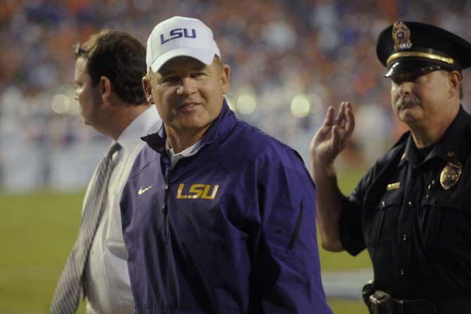 LSU head coach Les Miles walks towards the tunel at halftime Saturday, October 11, 2014 during the Tigers' 30-27 victory in Ben Hill Griffin Stadium.