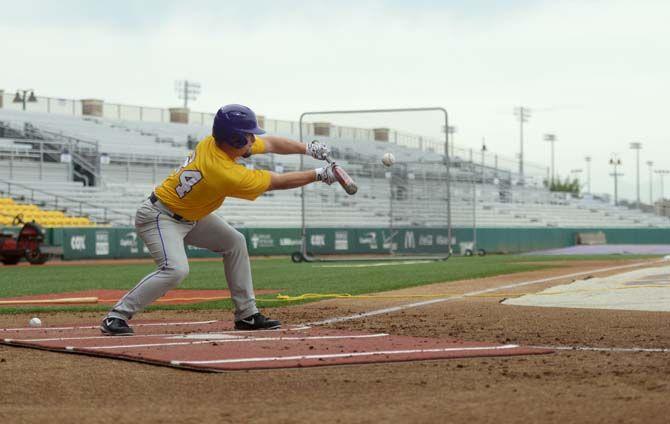 LSU freshman outfielder Beau Jordan bunts the ball Monday, October 6, 2014 during baseball practice in Alex Box Stadium.